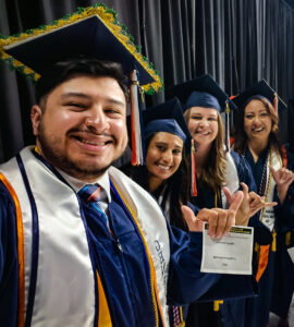 Mario and other UTSA graduates at commencement