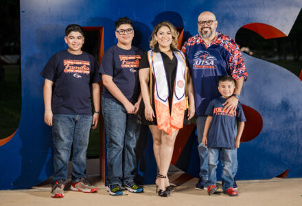 Elsa Treo and her family in front of the UTSA sculpture