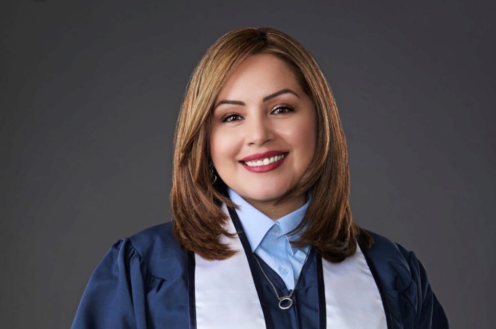 UT San Antonio Graduate Roxanne Contreras smiles while wearing her graduation regalia.