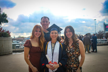 Sallye Barnes and her family at commencement