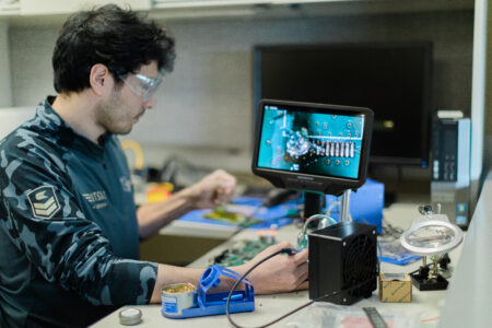Man working on technology systems.