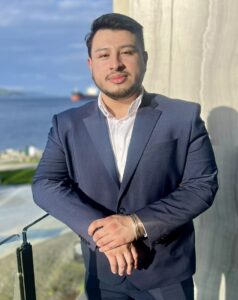 Mario Ortega headshot with Puget Sound behind him