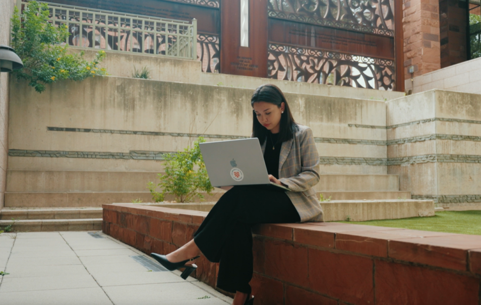 Julia Enriquez sits in the courtyard at the San Antonio Courthouse.